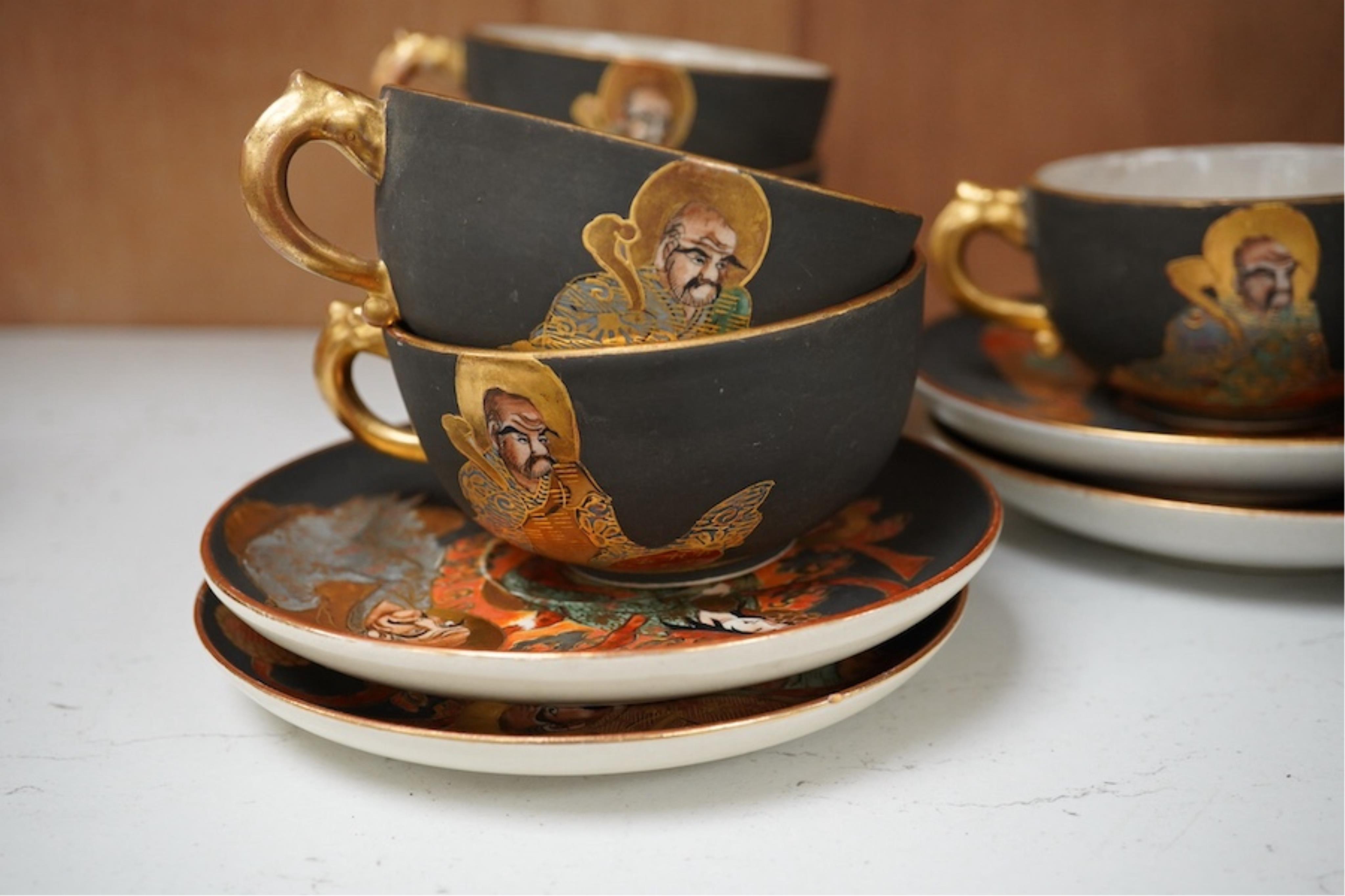 A Japanese Satsuma pottery enamel decorated tea set with Kwannon and rakan, teapot and cover 18cm high. Condition - one cup missing, one cup cracked